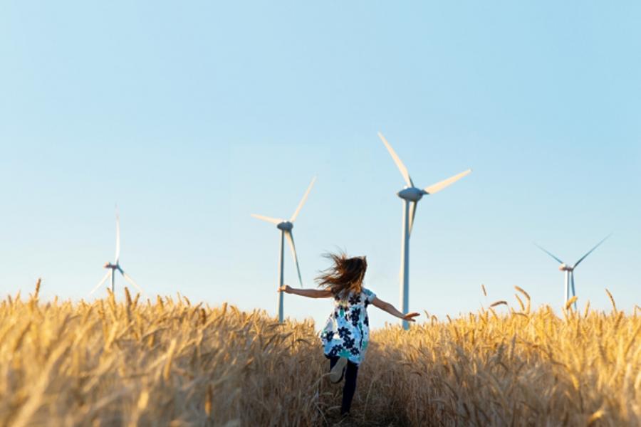 Little girl running in a field 